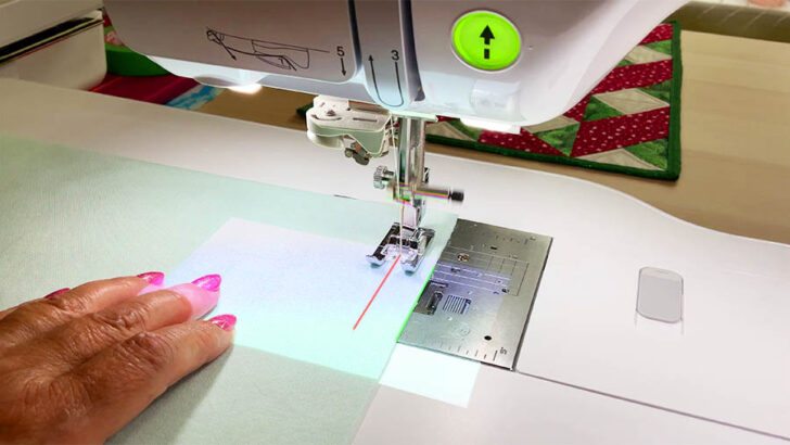 red laser aligns with the needle and the green laser marks the fabric edge