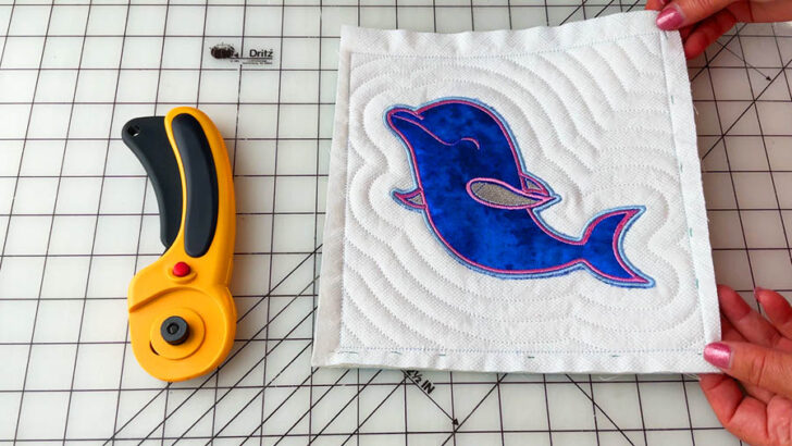 carefully trim the excess fabric using a rotary cutter