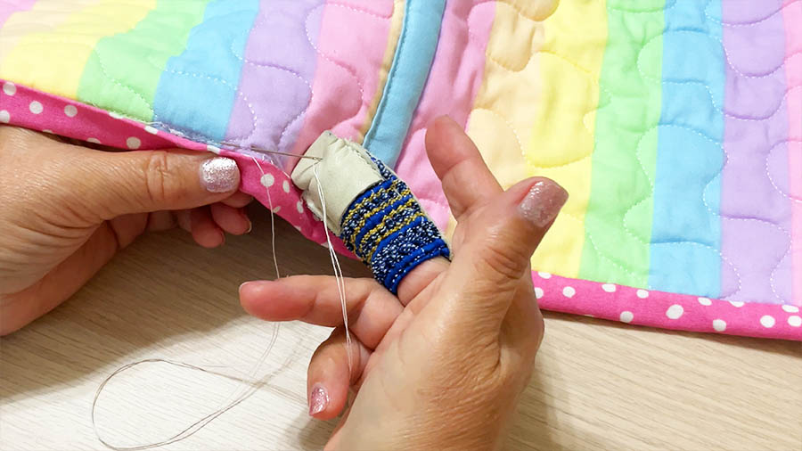 Dritz leather thimble protecting my finger