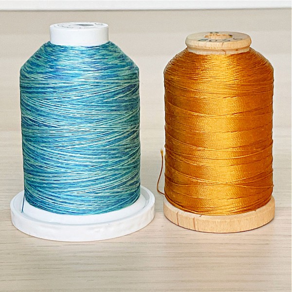 The image captures the intricate details and rich diversity of sewing thread options