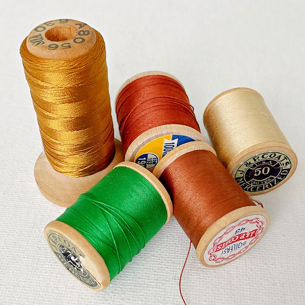 Image featuring vintage packaging of assorted sewing threads