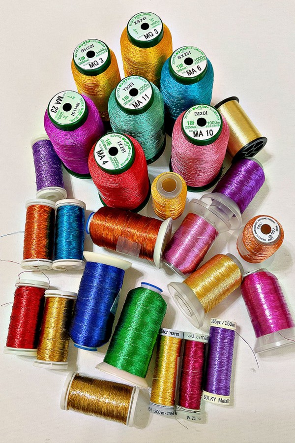 Variety of colorful threads, showcasing different types and textures for sewing projects