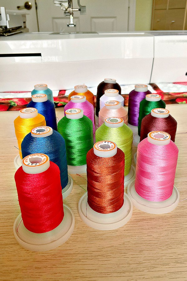 diverse selection of threads, each in a unique color and material, tailored for a variety of sewing and crafting needs