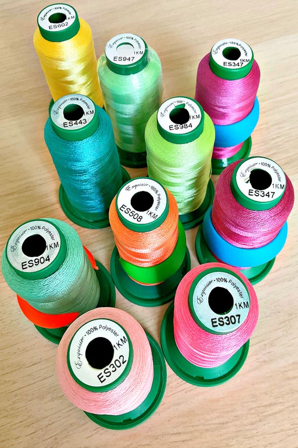 Assorted threads in a variety of colors and types, perfect for a diverse range of sewing and crafting projects