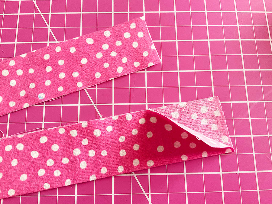 fold it in half lengthwise and press it with my iron