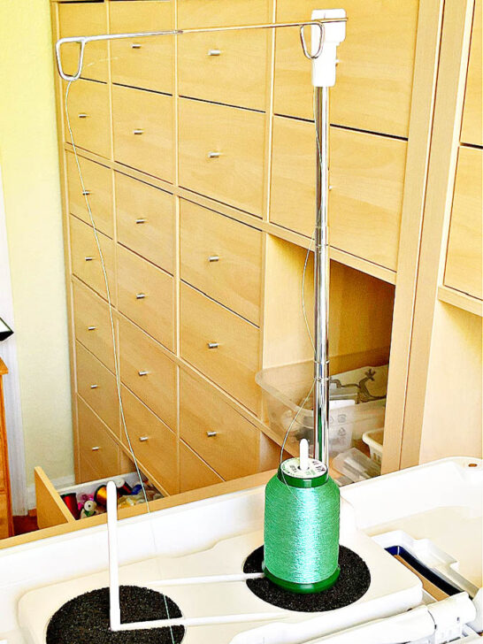 place the metallic thread on a vertical spool pin