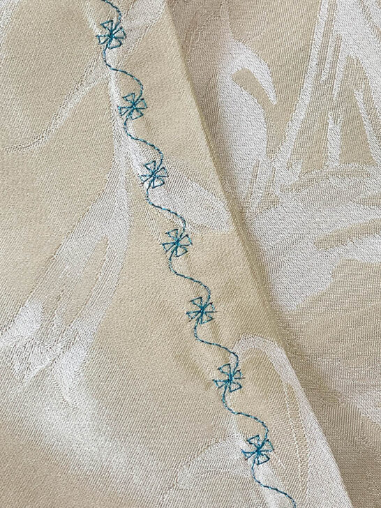 see the sleeve of my silk robe with metallic thread stitches