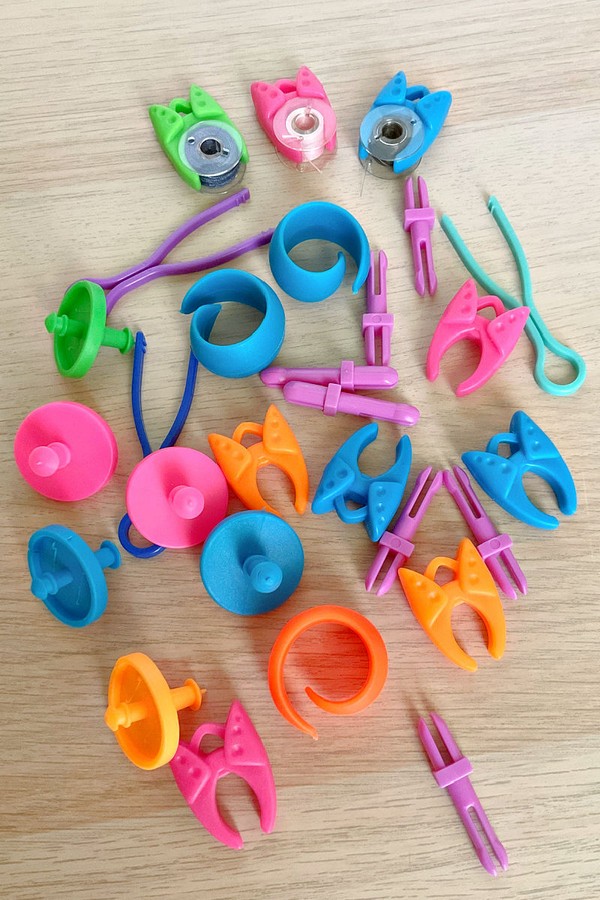 collection of sewing bobbin clips in a variety of vibrant colors