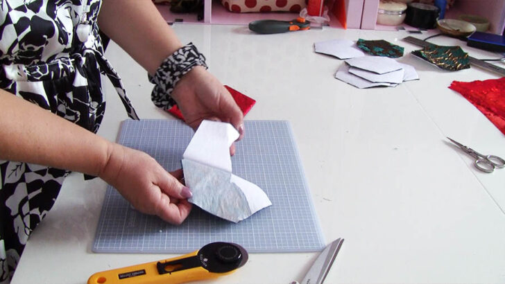 Remove the paper backing from your fabric hexagon appliques