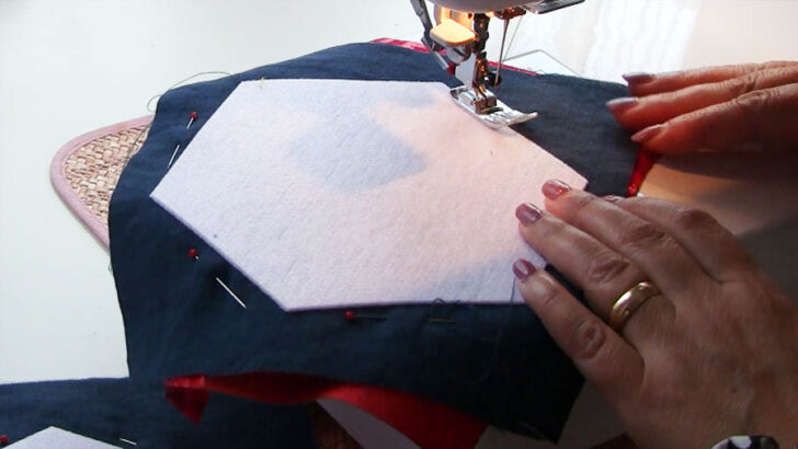 Sew around the entire perimeter of the fusible fleece hexagon