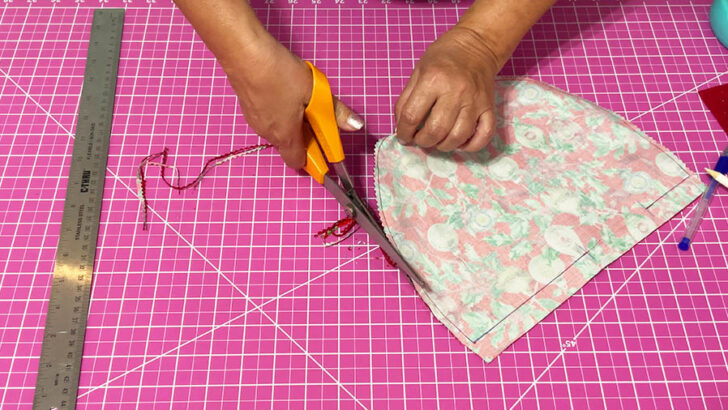 create small notches along the curved seam