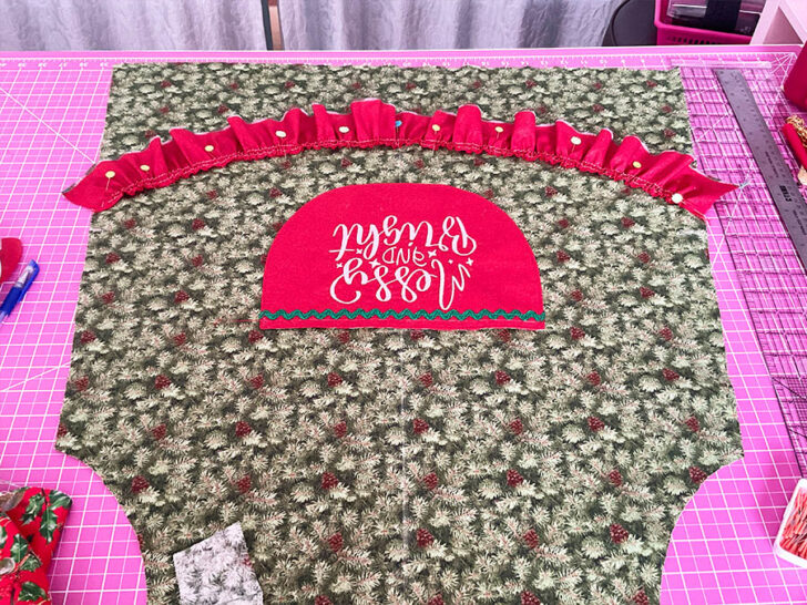 position the ruffle in a slight curve about 4 inches below the big pocket