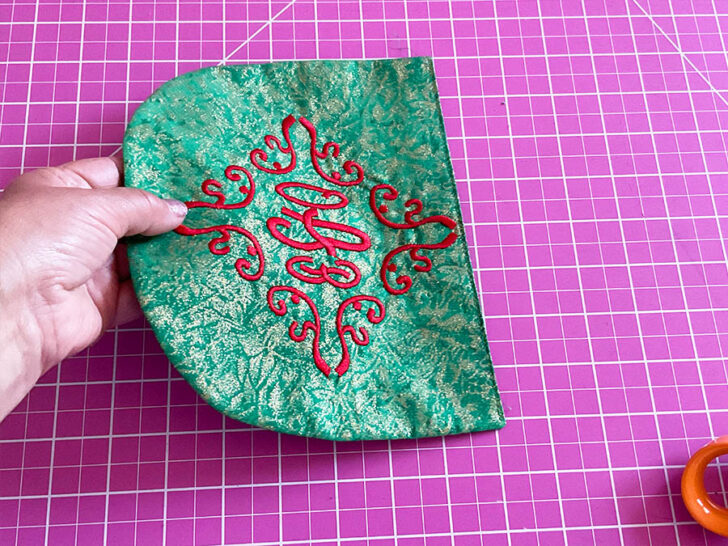 press the pocket and stitch the top edge