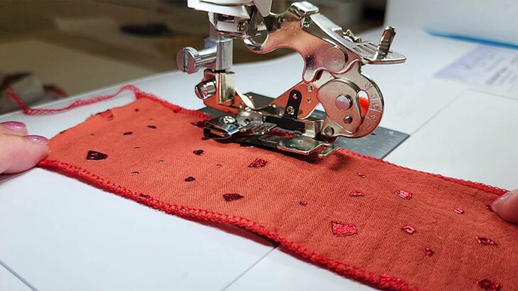Gently guide the fabric into the ruffler's waiting arms