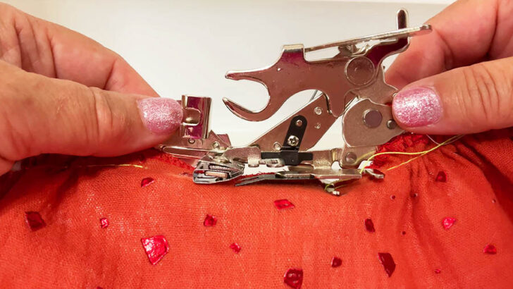 Line up the ruffler with the presser foot holder and secure it in place