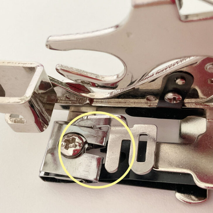 Make sure the needle is passing through the needle hole of the ruffler cleanly