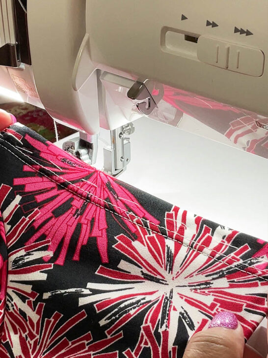 coverstitch hem on a red printed fabric