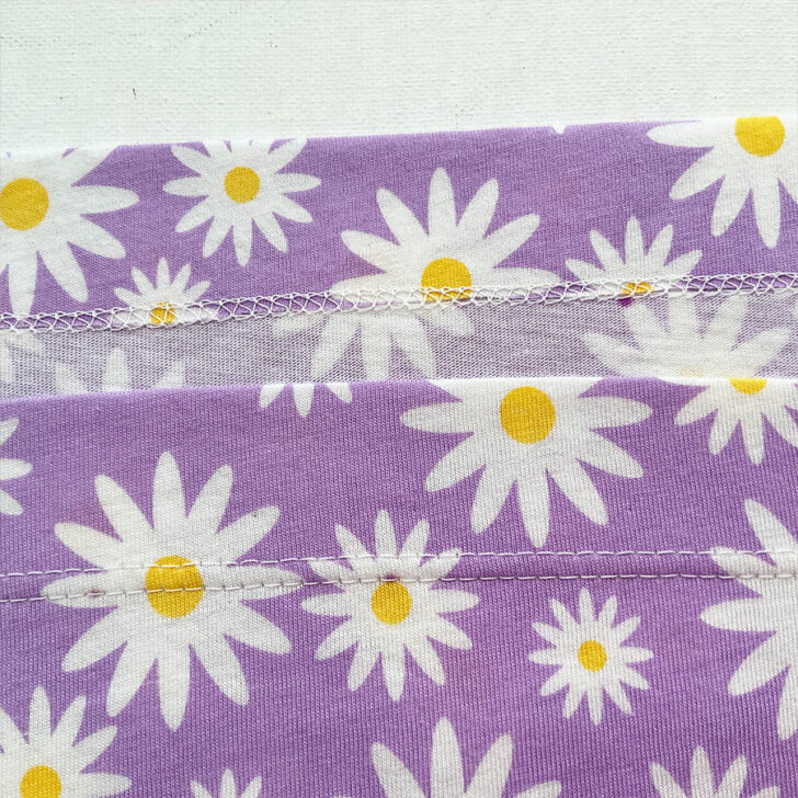 coverstitch on a purple floral fabric