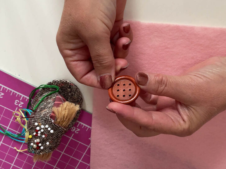9 hole brown button