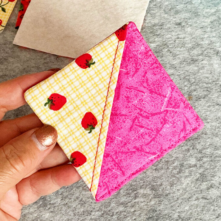 Topstitch around the two sides without the corner fabric