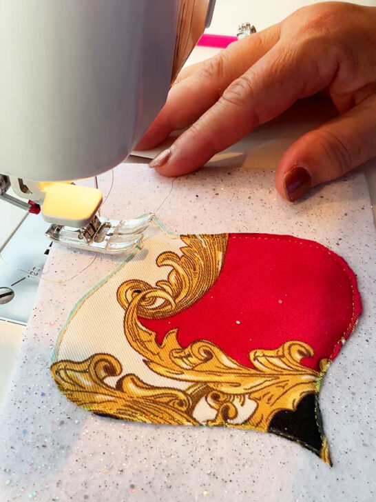 carefully sew around the edge of the fabric shape