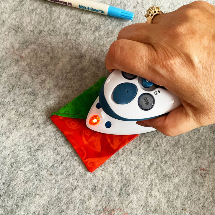 press the bookmark, tucking in the opening
