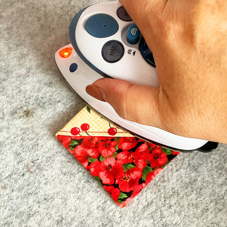 press the bookmark, tucking in the opening