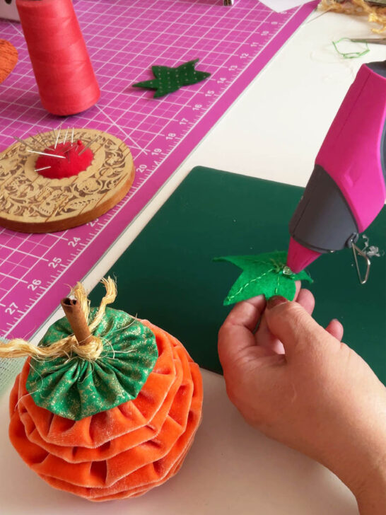 use hot glue to secure the leaf in place