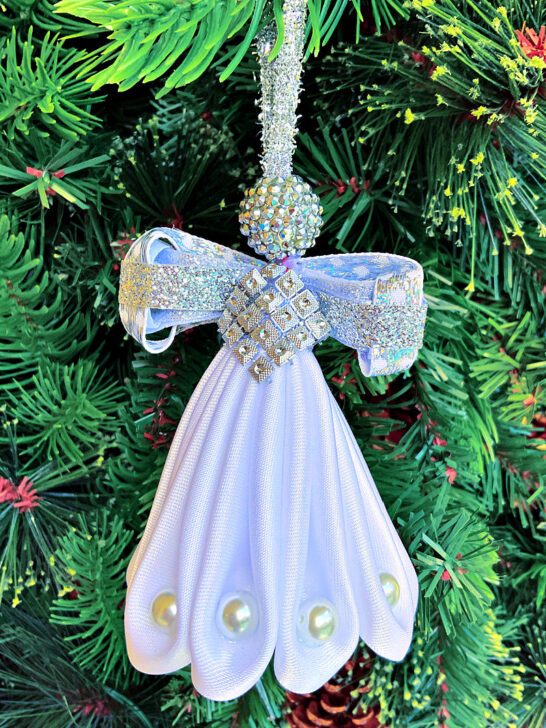 Homemade Christmas ornament - an angel made from white fabric with pearls.