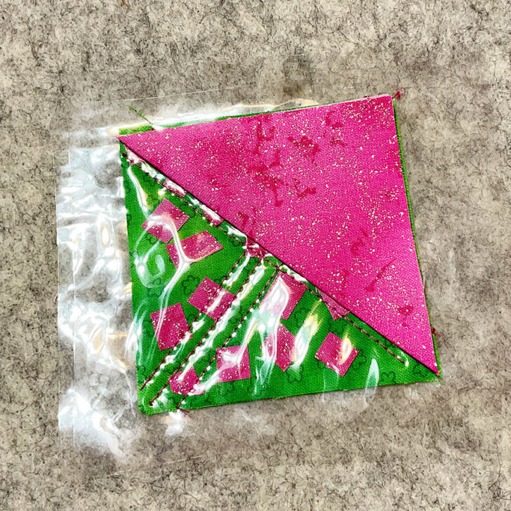 place the fabric triangle on top of vinyl