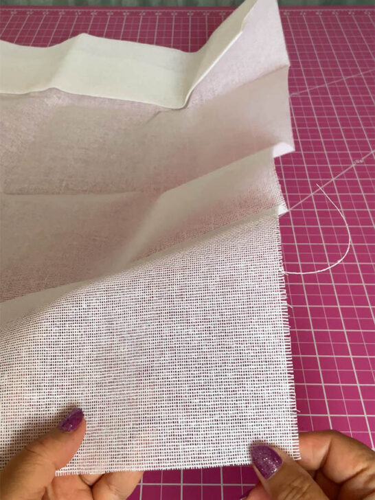A close-up buckram fabric, highlighting the texture and craftsmanship