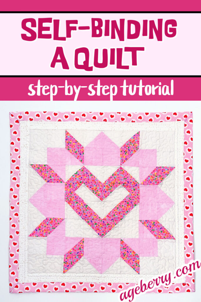 Full view of a heart-themed quilt with pink and red patterns, featuring text overlay: "Self-Binding a Quilt - Step-by-Step Tutorial," demonstrating a completed self-binding quilt project with neat mitered corners.