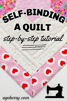 Close-up of a mitered corner on a quilt with a pink and red heart backing, featuring text overlay: "Self-Binding a Quilt - Step-by-Step Tutorial," showcasing a clean self-binding quilt finish.