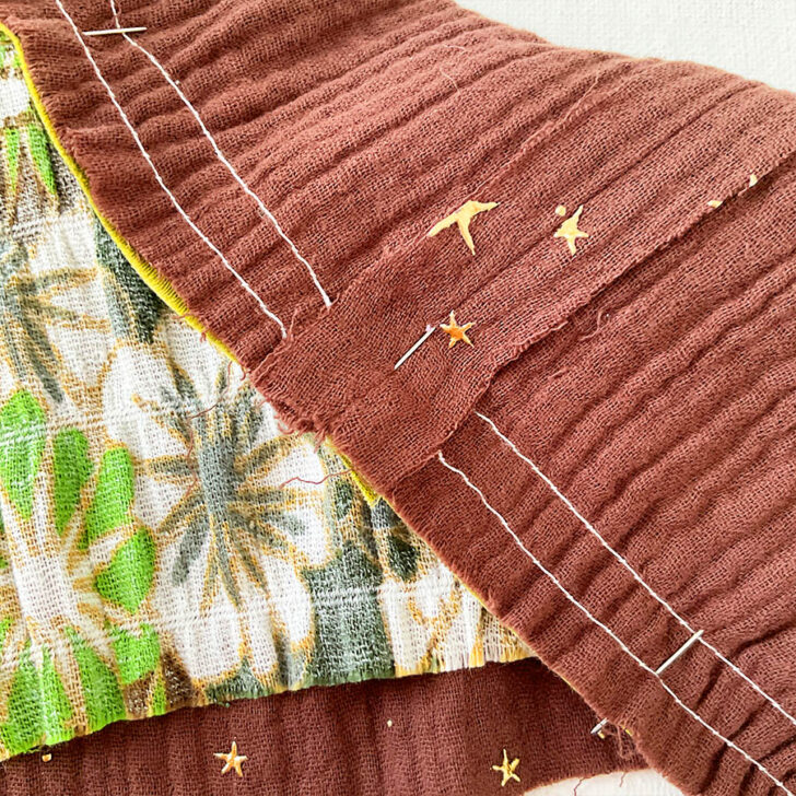 The pin seen in the back of the fabric is positioned exactly in the seam line. This is very important for matching seams perfectly.