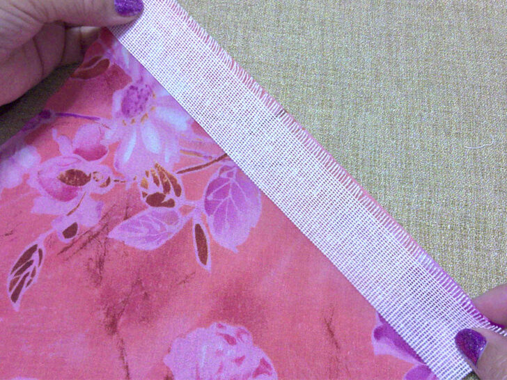 me aligning the chiffon fabric onto the frayed edge of buckram fabric