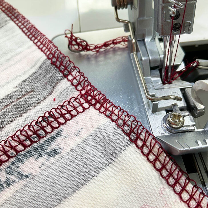 Carefully remove the basting thread and cut the thread tails from the serger seam