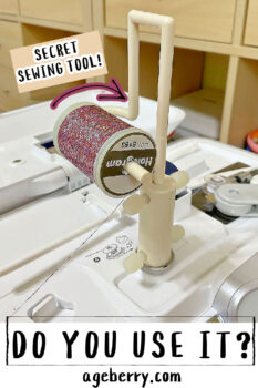 A sewing machine with a thread spool pin adapter holding a holographic thread spool, demonstrating how this sewing tool helps with smooth thread rotation and proper unwinding for specialty threads