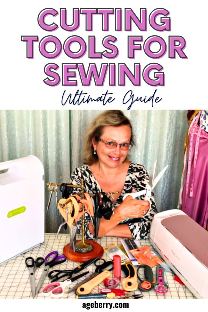 A woman smiling at a sewing workspace filled with various cutting tools, including scissors, rotary cutters, and an AccuQuilt cutting machine. The text overlay introduces an ultimate guide to sewing cutting tools. Learn more at Ageberry.com.