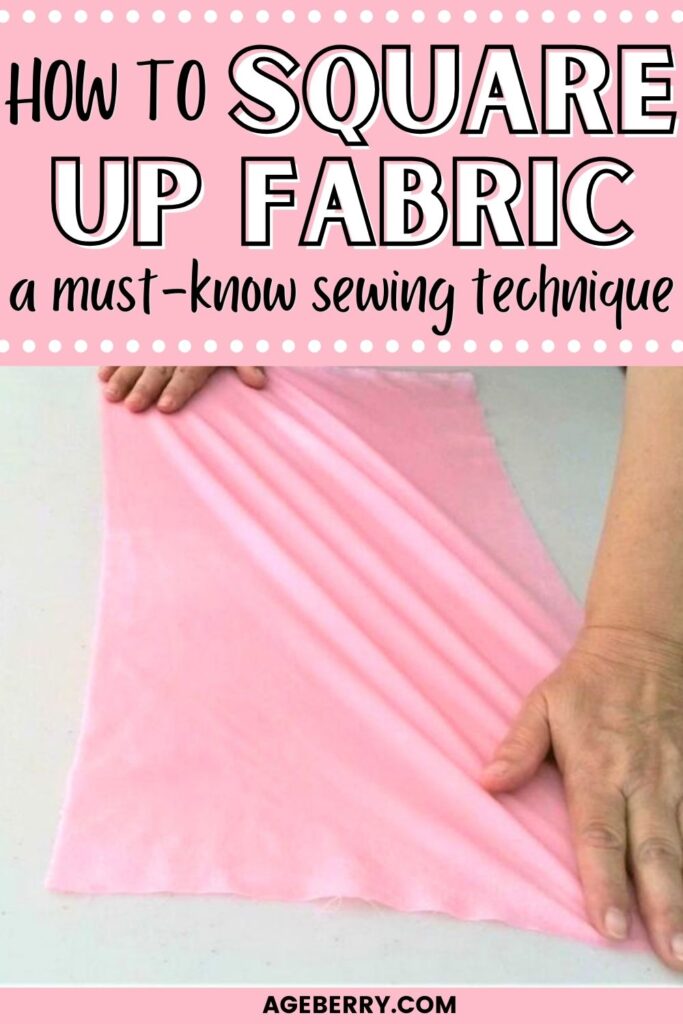 A pair of hands smoothing out a pink fabric on a white surface. The text overlay reads "How to Square Up Fabric - A Must-Know Sewing Technique." This image is part of a sewing tutorial from Ageberry.com, demonstrating the process of squaring fabric to ensure accurate cutting and sewing.