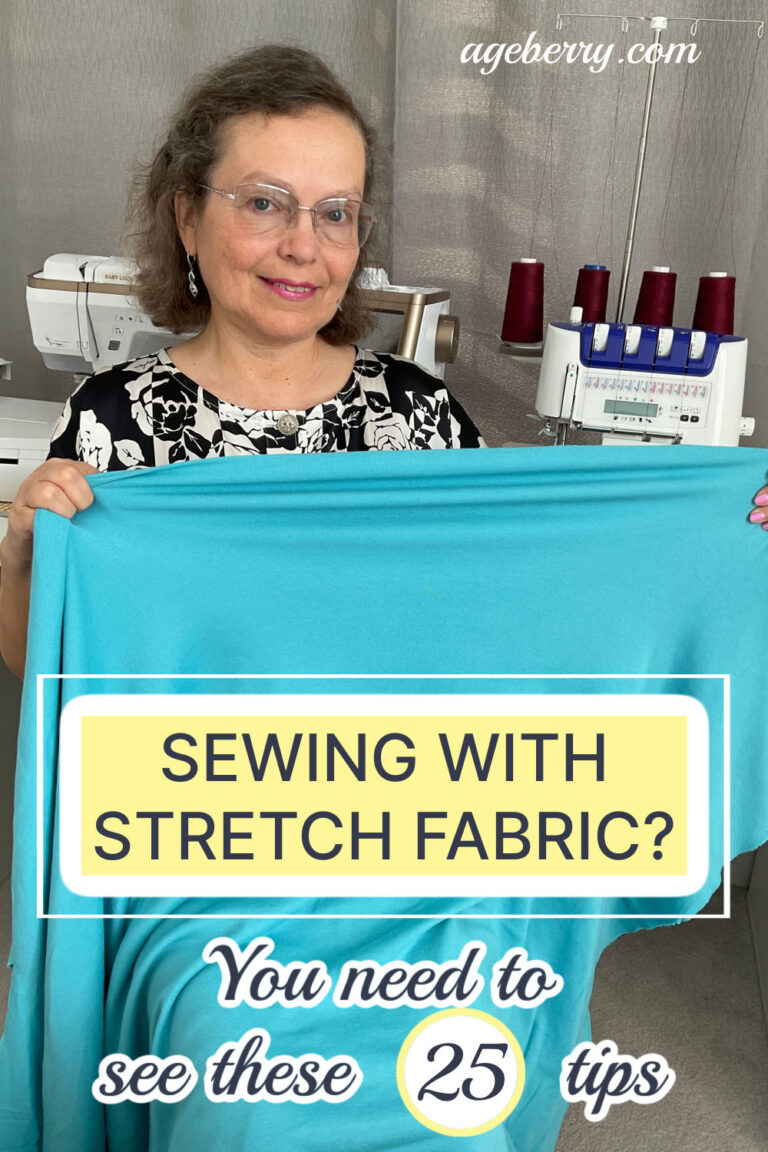 A woman holding a piece of bright turquoise stretch fabric in front of her, smiling at the camera. Behind her, a sewing machine and a serger with red thread spools are visible. The text overlay reads "Sewing with Stretch Fabric? You need to see these 25 tips," with the website "ageberry.com" at the top.