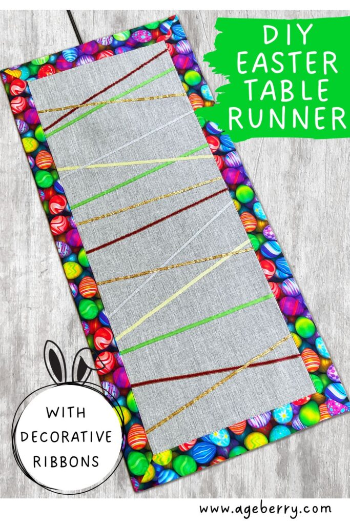 The image shows an Easter themed table runner made with various decorative and sequin ribbons with a binding suggesting colored eggs. The text over the image is "DIY Easter table runner with decorative ribbons" and the logo www.ageberry.com
