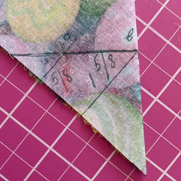 Marking on the fabric points a and b in preparation for sewing the mitered corner