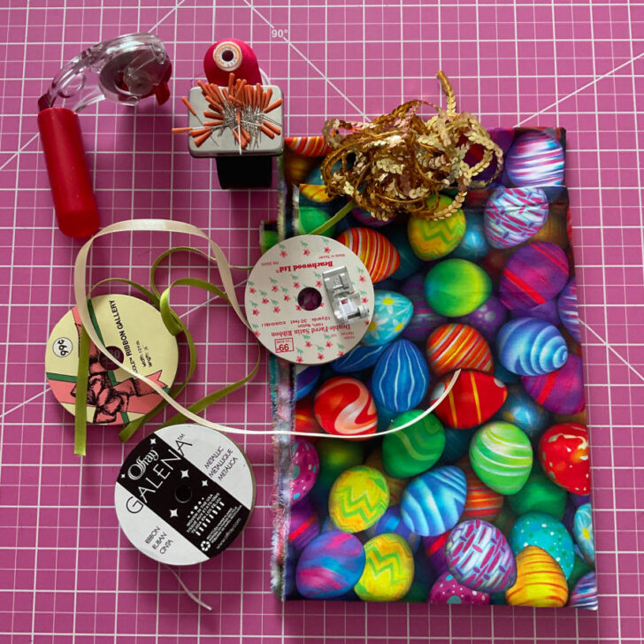 The image shows the materials tools and notions used to make the Easter themed table runner
