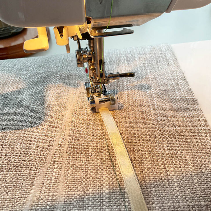 An image of the sequin ribbon presser foot while sewing