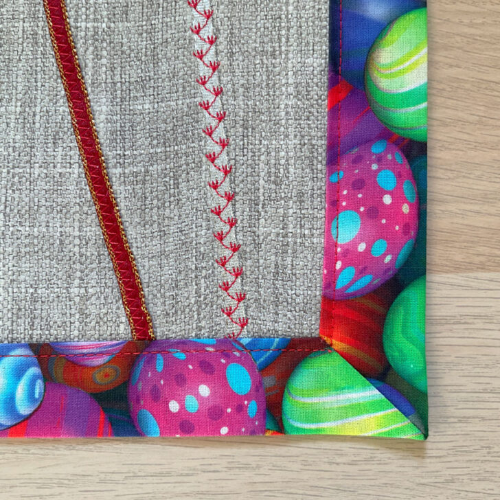 Image shows a close up of a corner of the Easter placemat after the final press