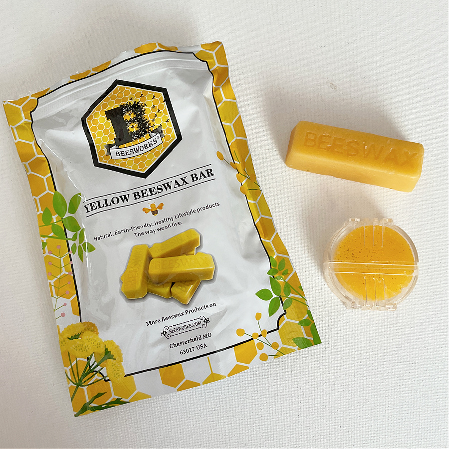 A package of yellow beeswax bars labeled "Beesworks" is shown alongside a rectangular beeswax bar and a small circular container of beeswax.