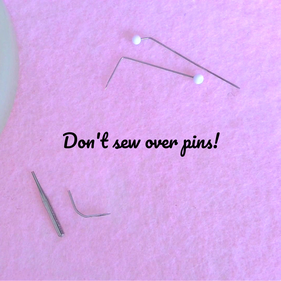 various broken and bent pins due to sewing without removing them first