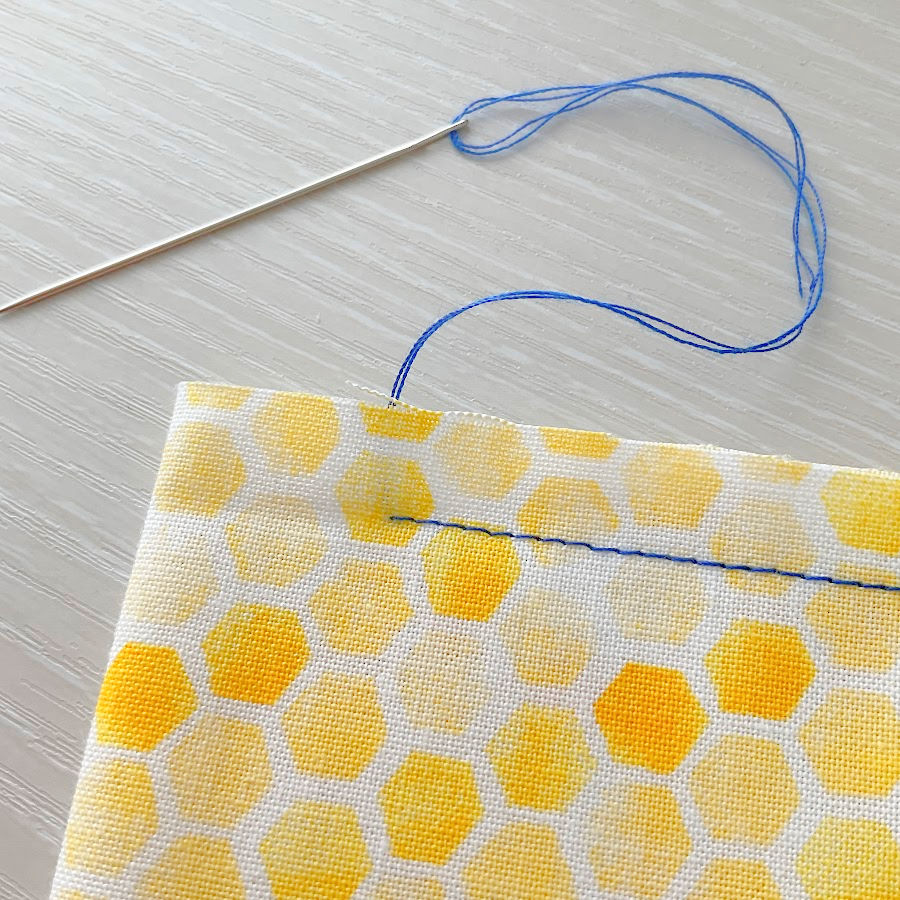 hiding the thread tails manually using a hand sewing needle final image showing the result