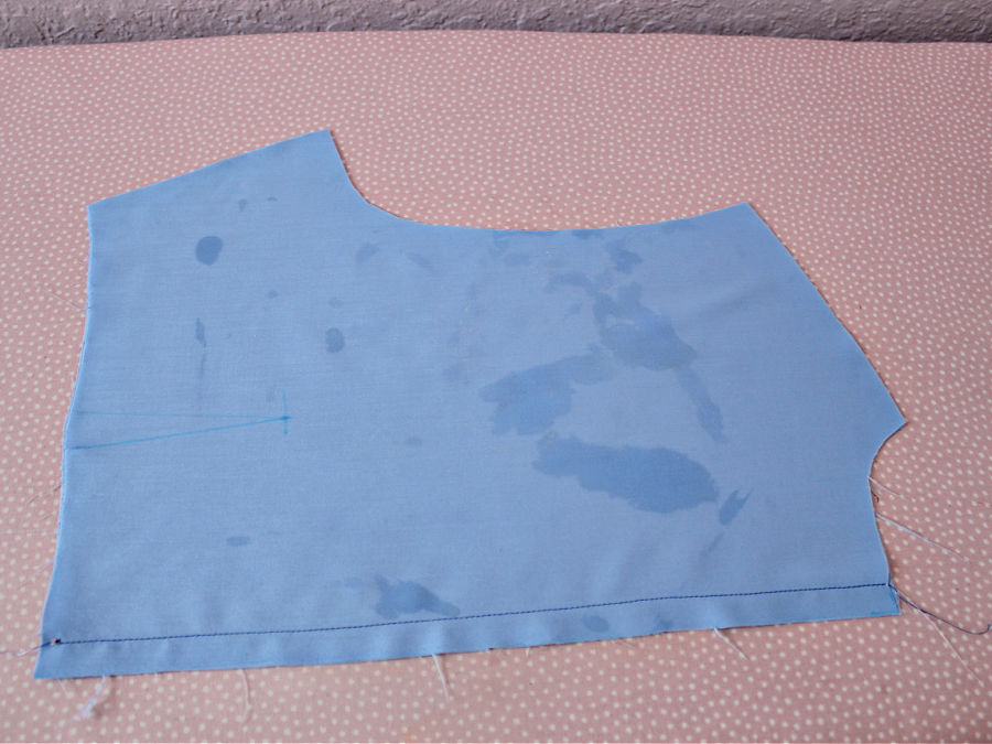 a piece of material with water spots after ironing with a defective iron