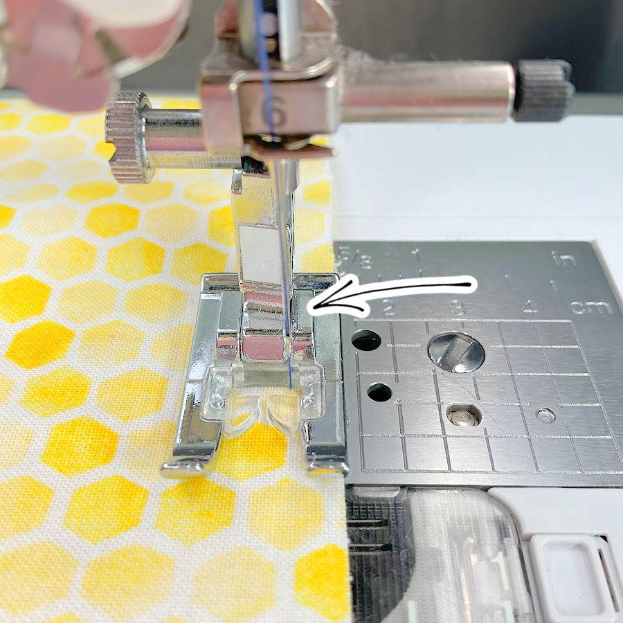 The needle on a sewing machine moved slightly to the right to make a narrow seam